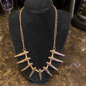 Precious gold metal abstract necklace.